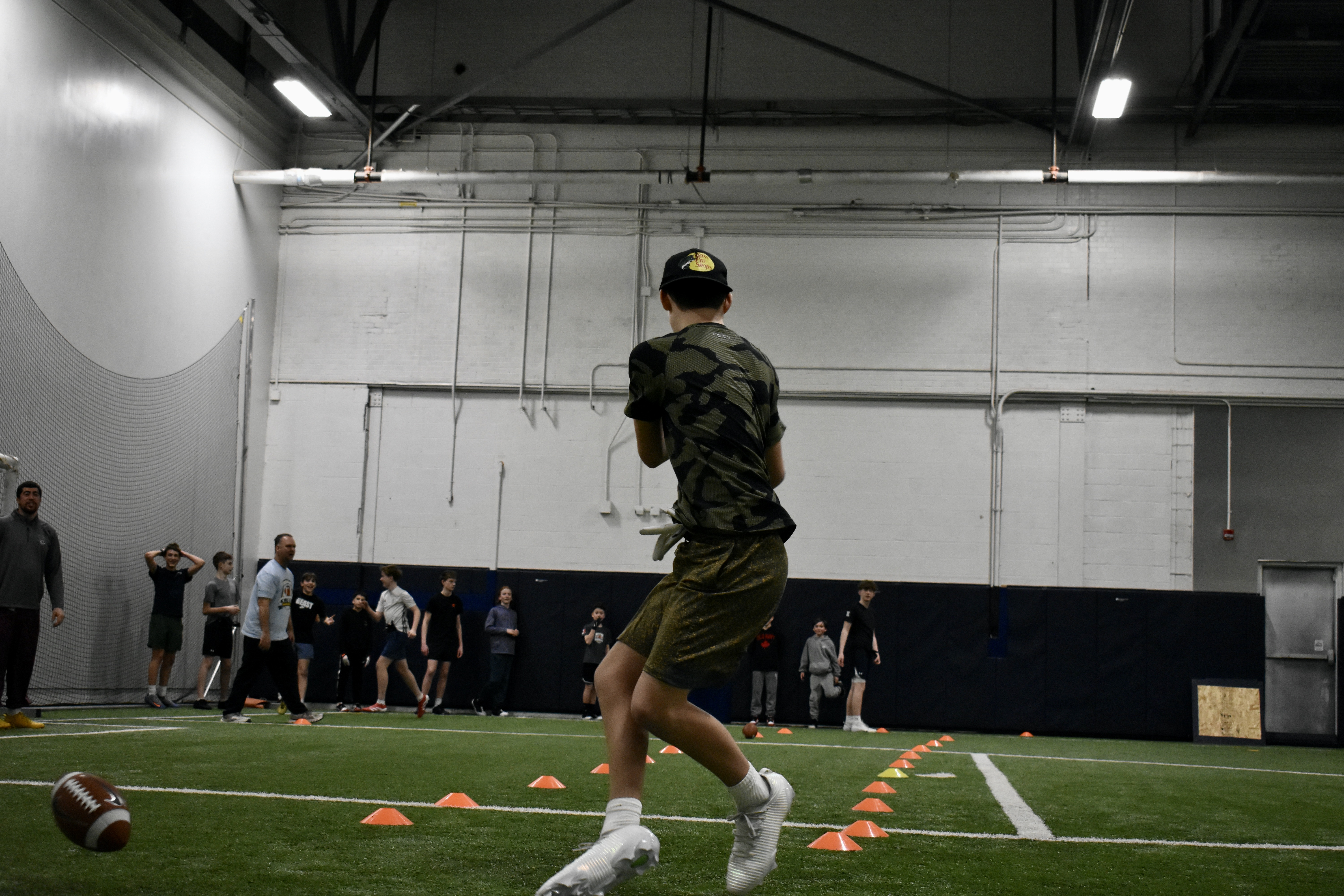 KMFL youth football players practicing wide receiver drills